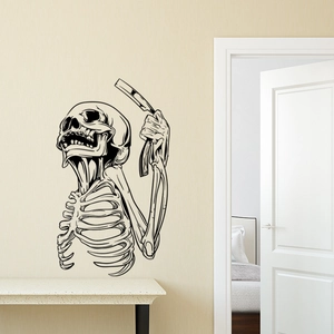 Detailed macro view of a black skeleton wall decal with a razor on a minimalist beige wall