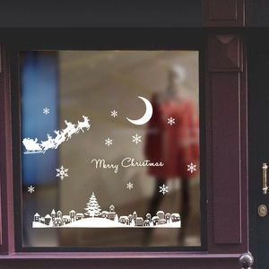 White Christmas window decals featuring Santa, snowflakes and Merry Christmas lettering