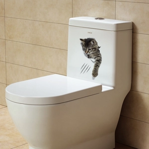 Detail showing 3D cartoon cat sticker with lifelike fur and scratch marks on a toilet tank