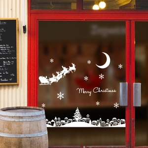White Christmas window decals featuring Santa, reindeer, and moonlight town silhouettes