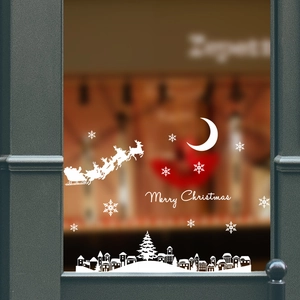 Detailed white Christmas window stickers featuring Santa, moon, and town silhouette
