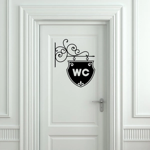 Vintage style WC wall sticker with elegant scrollwork on a white door surface