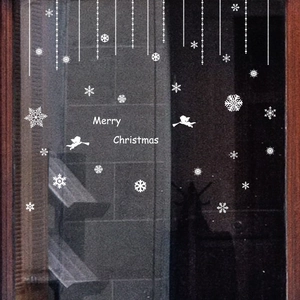 White Christmas window stickers featuring snowflakes, angels and Merry Christmas text