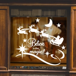 White Christmas window decal featuring Santa's reindeer sleigh and Believe in the magic text