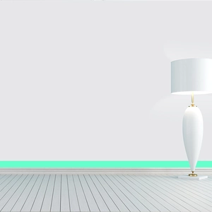 Luminous fluorescent green self-adhesive wall tape shown applied along the baseboard