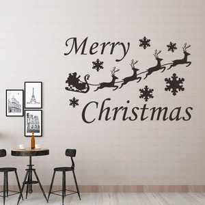 Christmas wall stickers with Santa Claus reindeer and snowflakes on a living room wall