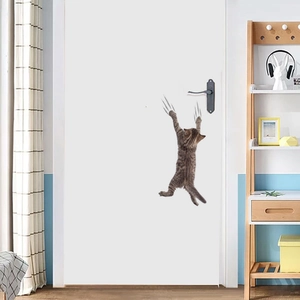 Creative 3D cat wall sticker with scratch marks on a white door near handle