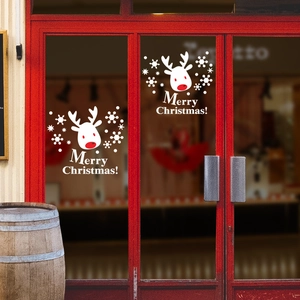 White Christmas reindeer window decals with snowflakes and Merry Christmas text on glass