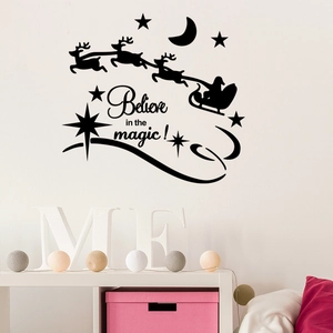 Christmas wall decal with Santa sleigh and Believe in the magic quote on white wall
