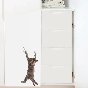 Detailed view of a 3D tabby cat wall sticker with realistic gray scratch marks on a white closet