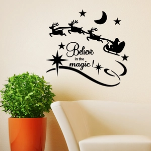 Black silhouette Christmas wall decal with Santa's sleigh and Believe in the Magic text