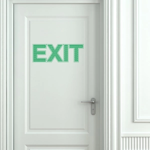 Autocollant mural EXIT vert luminescent avec texture en nid d'abeille sur porte blanche