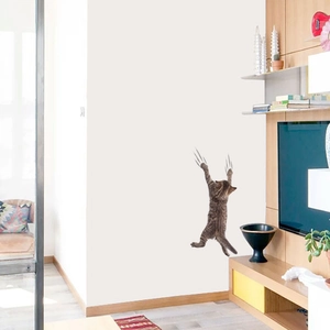 Detail of creative cat wall sticker showing realistic claw marks on white living room wall