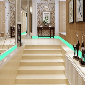 Glow-in-the-dark luminous green tape applied to baseboards for night safety guidance