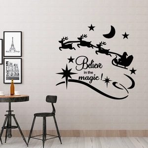 Detail of Christmas wall sticker with Santa sleigh silhouette and Believe in the magic text