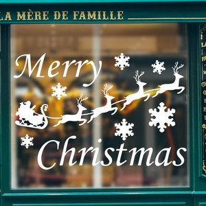Christmas window sticker with white Merry Christmas text, snowflakes and Santa reindeer silhouette
