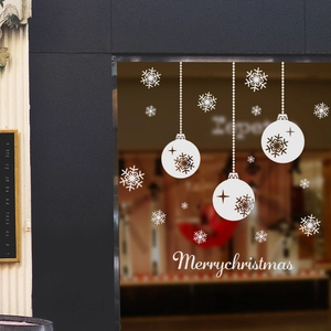 White Christmas window decals with snowflakes and hanging ball ornaments decoration
