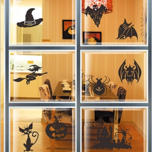 Halloween vinyl silhouette wall decals featuring witch, bats, ghost, and pumpkin on glass
