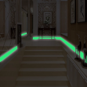 Glow-in-the-dark green tape applied to stairs and wall edges for night warning