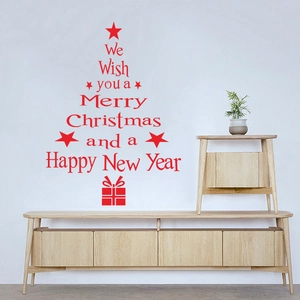 Detail of red Christmas tree wall decal with festive typography on a white living room wall