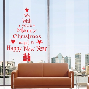 Red Christmas tree wall sticker with holiday greetings on a large living room window
