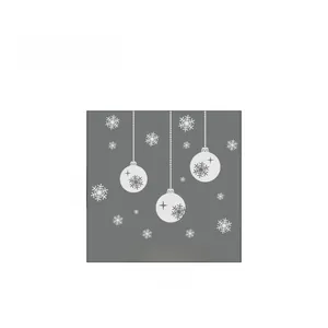 Detail view of white Christmas snowflake decals and hanging ball stickers for window glass
