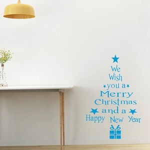 Detail view of sky blue Merry Christmas tree wall decal in a minimalist home setting