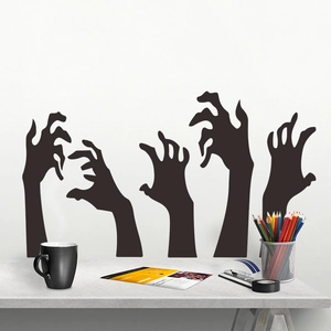 Detail showing five black zombie hand silhouette wall decals in a room setting