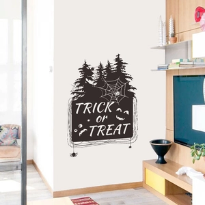 Detail of Halloween Trick or Treat wall decal featuring bat and spider web silhouettes