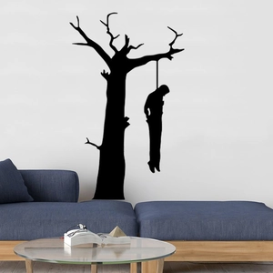 Spooky Halloween silhouette wall decal featuring a dead tree and hanging figure on white wall
