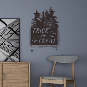 Detailed scene of Halloween wall decal featuring Trick or Treat text with ghost and spider webs