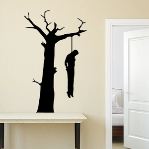 Macro detail of Halloween silhouette wall sticker featuring a spooky dead tree and figure