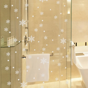 White Christmas snowflake window clings for glass decoration in home bathroom setting