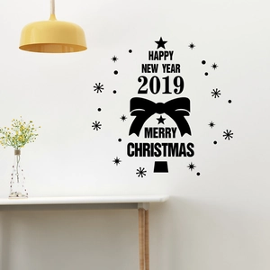 Black Christmas tree wall sticker with stars and bows on white wall with lamp