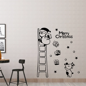 Detail view of black Santa Claus wall sticker with Merry Christmas text on a light wall