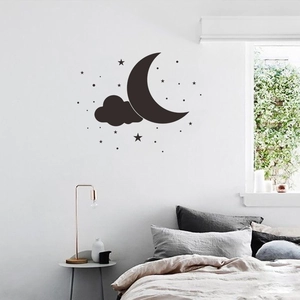 Detailed close-up of cloud and moon wall stickers in a cozy minimalist bedroom setup