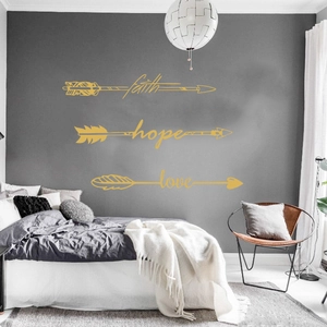 Golden faith hope love arrow wall decals in a modern bedroom setting for home decor