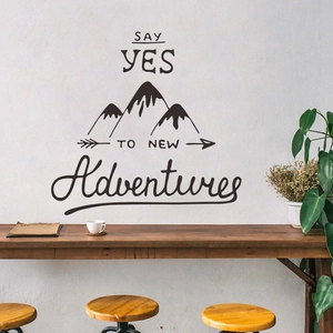 Detailed view of mountain peak decal with Say Yes To New Adventures lettering