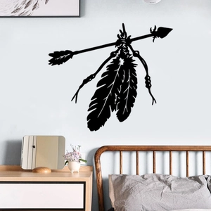 Close-up of black Indian feather arrow wall decal sticker in a bohemian bedroom setting