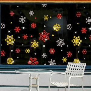 Close-up of colorful Christmas snowflake window stickers with glitter finish for decor