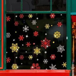 Glitter Christmas snowflake window stickers in red, gold, and silver for holiday decor