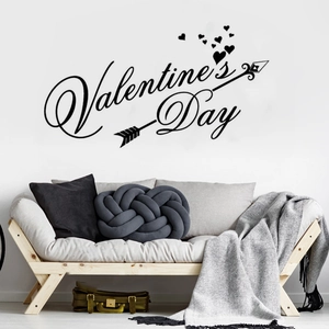 Detailed view of black Valentine's Day wall sticker with heart and arrow in a living room