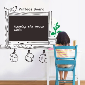 Detail of vintage chalkboard wall sticker with bird and potted plant for home decoration