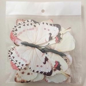 Macro shot of 12pcs 3D butterfly wall stickers in white with lifelike patterns and packaging