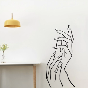 Modern black line art wall sticker showing minimalist hands on a living room wall
