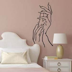 Elegant minimalist line art wall sticker featuring two delicate hands on a bedroom wall