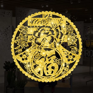 Detail of a golden glitter CNY Fu character sticker with peony hollow-out floral patterns