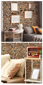 Detail of 3D pebble stone wallpaper showing natural gray texture in a modern bedroom