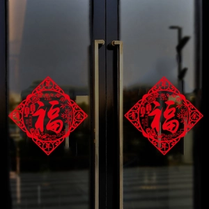 Detail of red hollowed-out Fu character window stickers for Chinese New Year decor