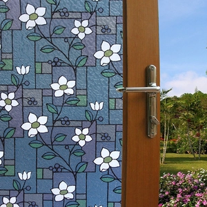 Frosted window film with white flowers and geometric patterns for home privacy